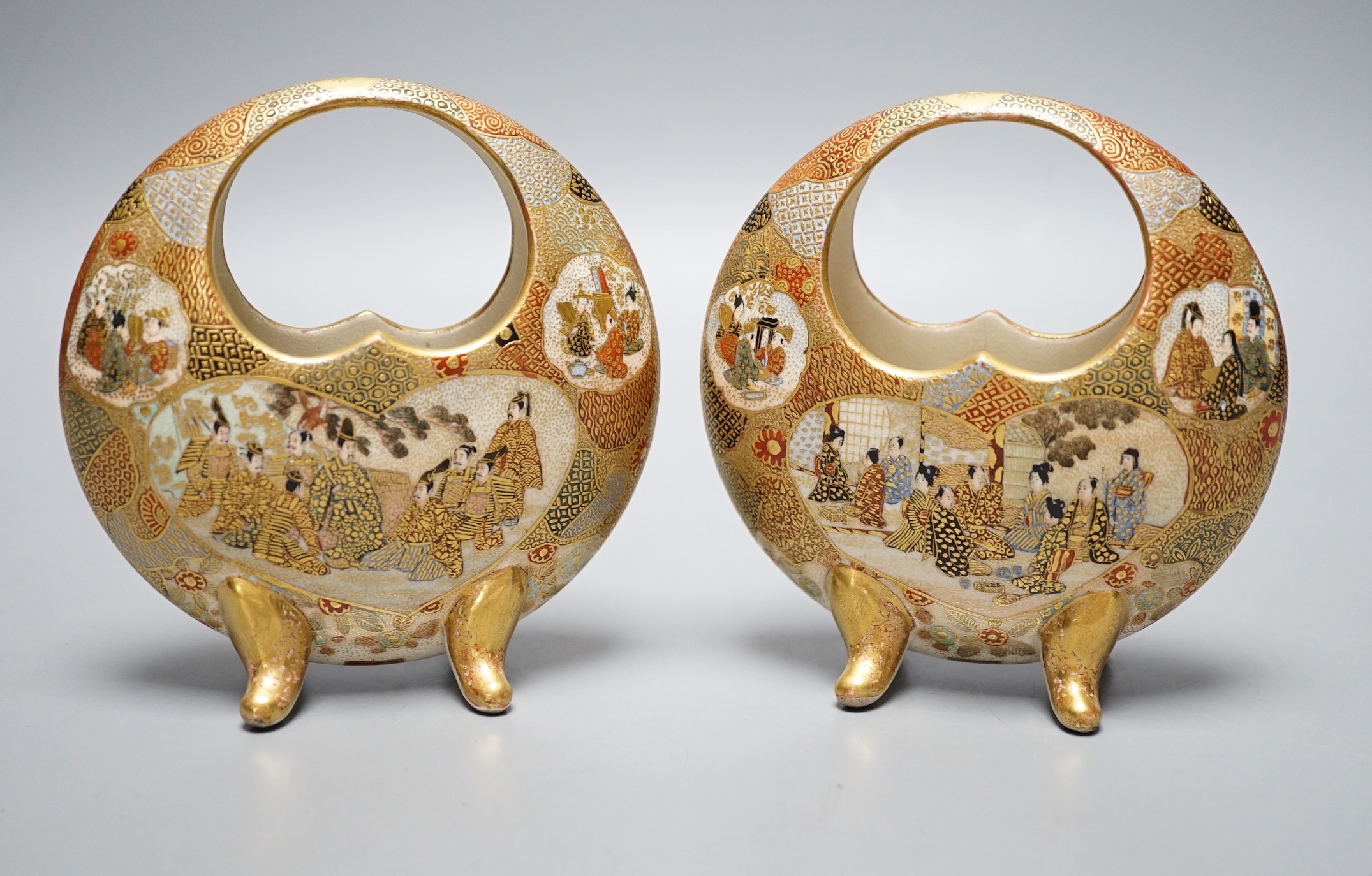 A pair of Japanese Satsuma crescent vases on quad footed base, signed to base, 11.5cm tall